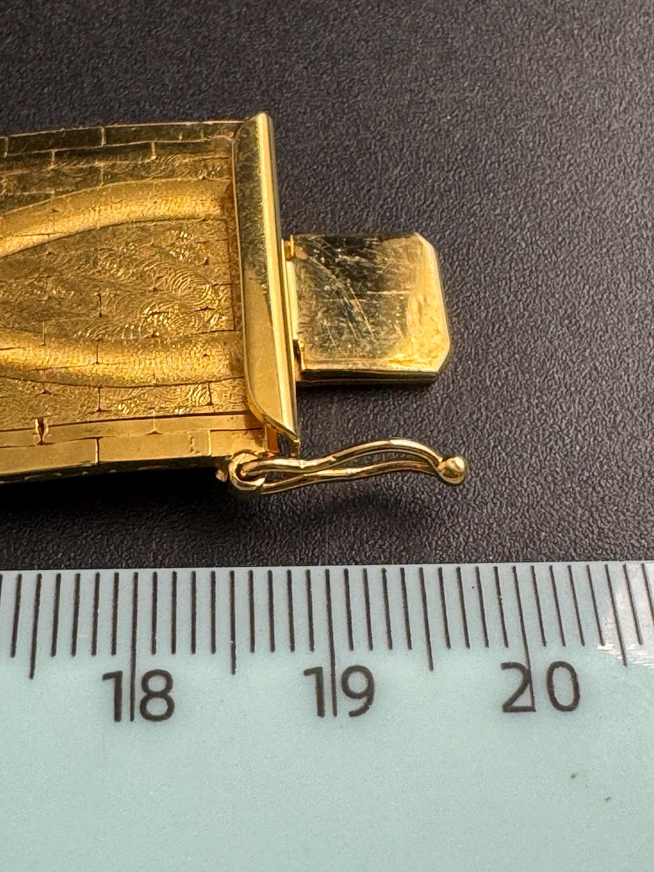 Wide gold plated flat bracelet, articulated 1970s