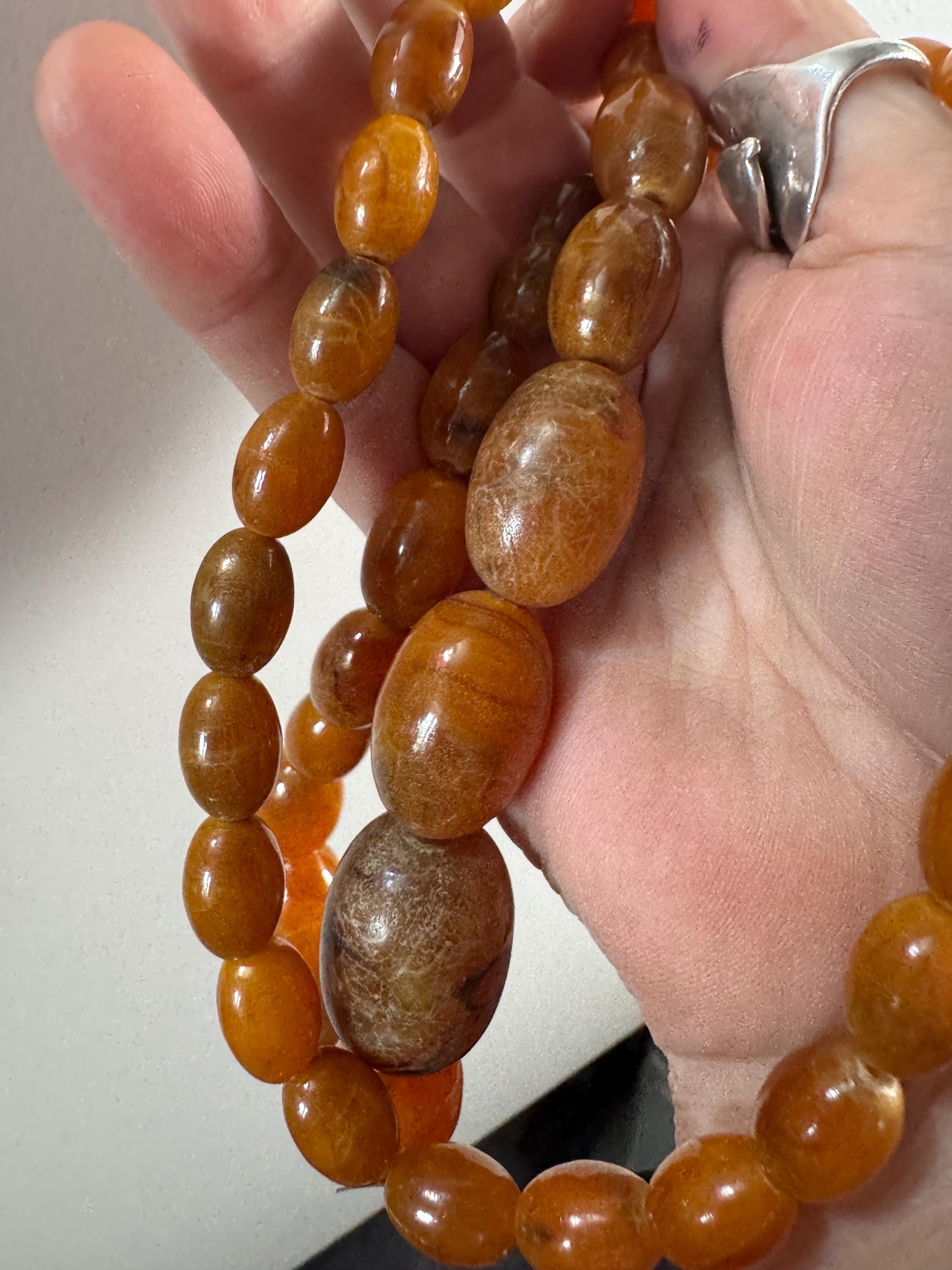 Long Faux Amber orange brown beaded necklace, oval plastic beads