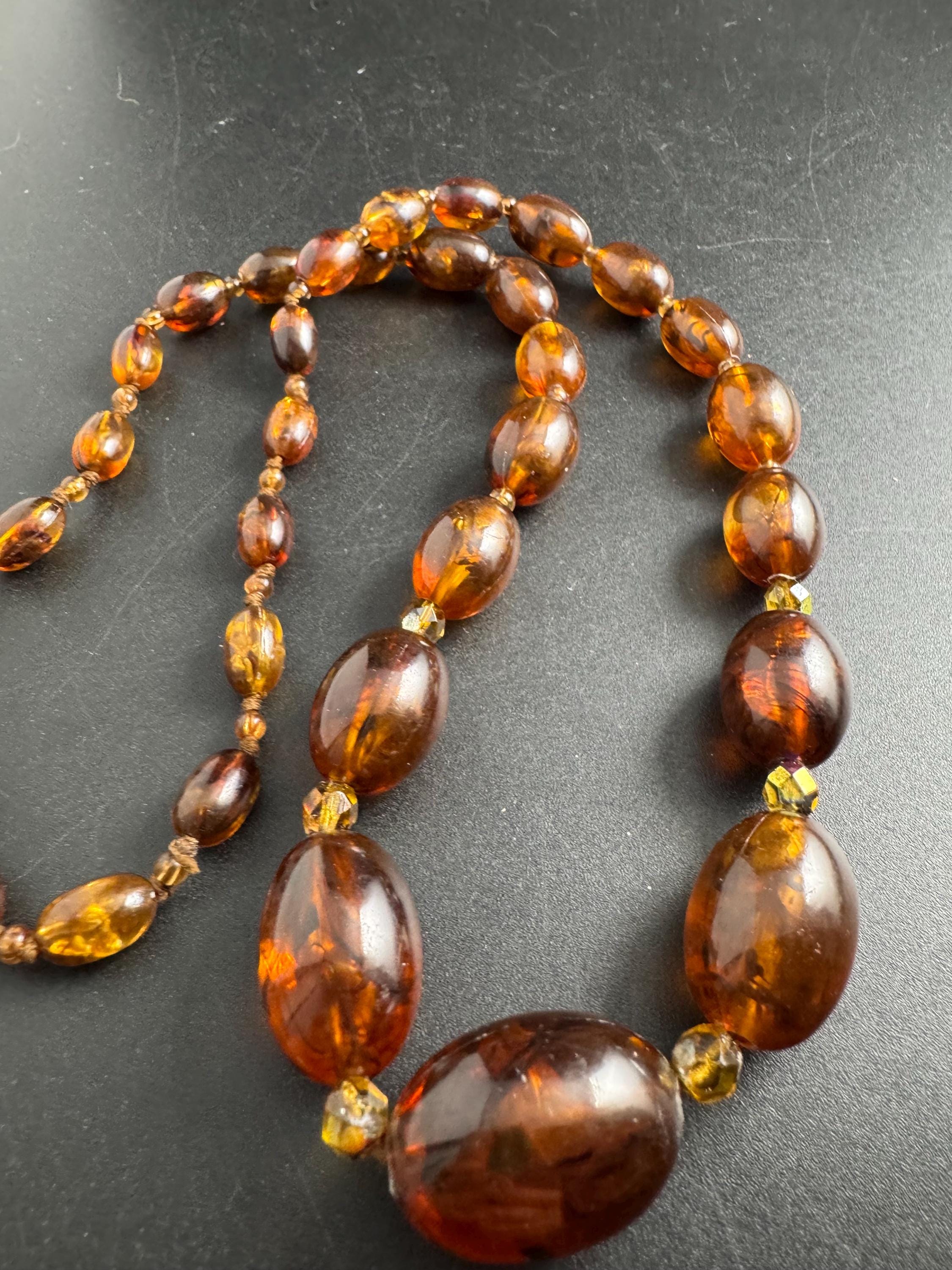 Long Faux Amber orange brown beaded necklace, oval plastic beads