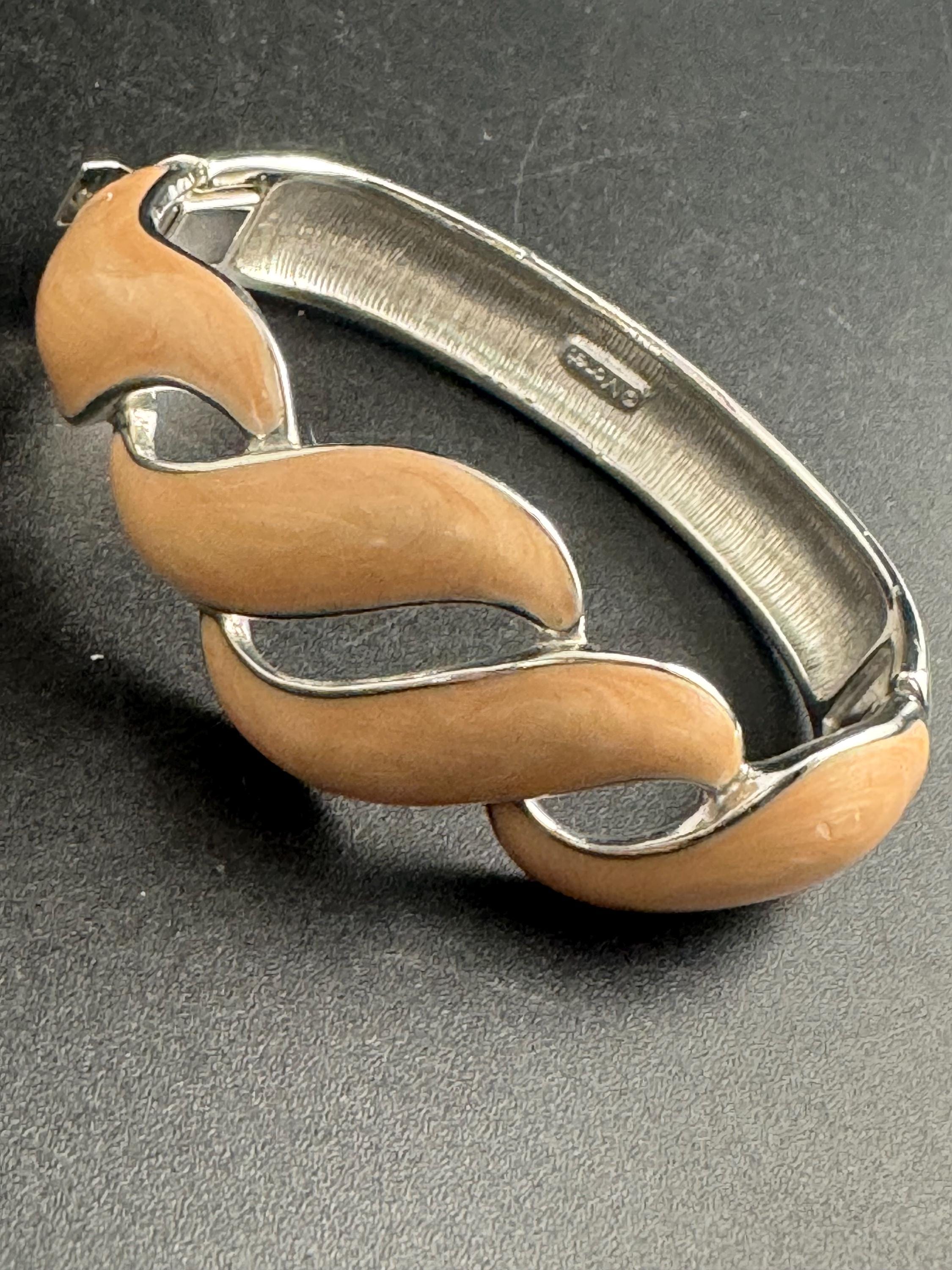 Beige enamel Monet bangle , silver tone clamper and signed