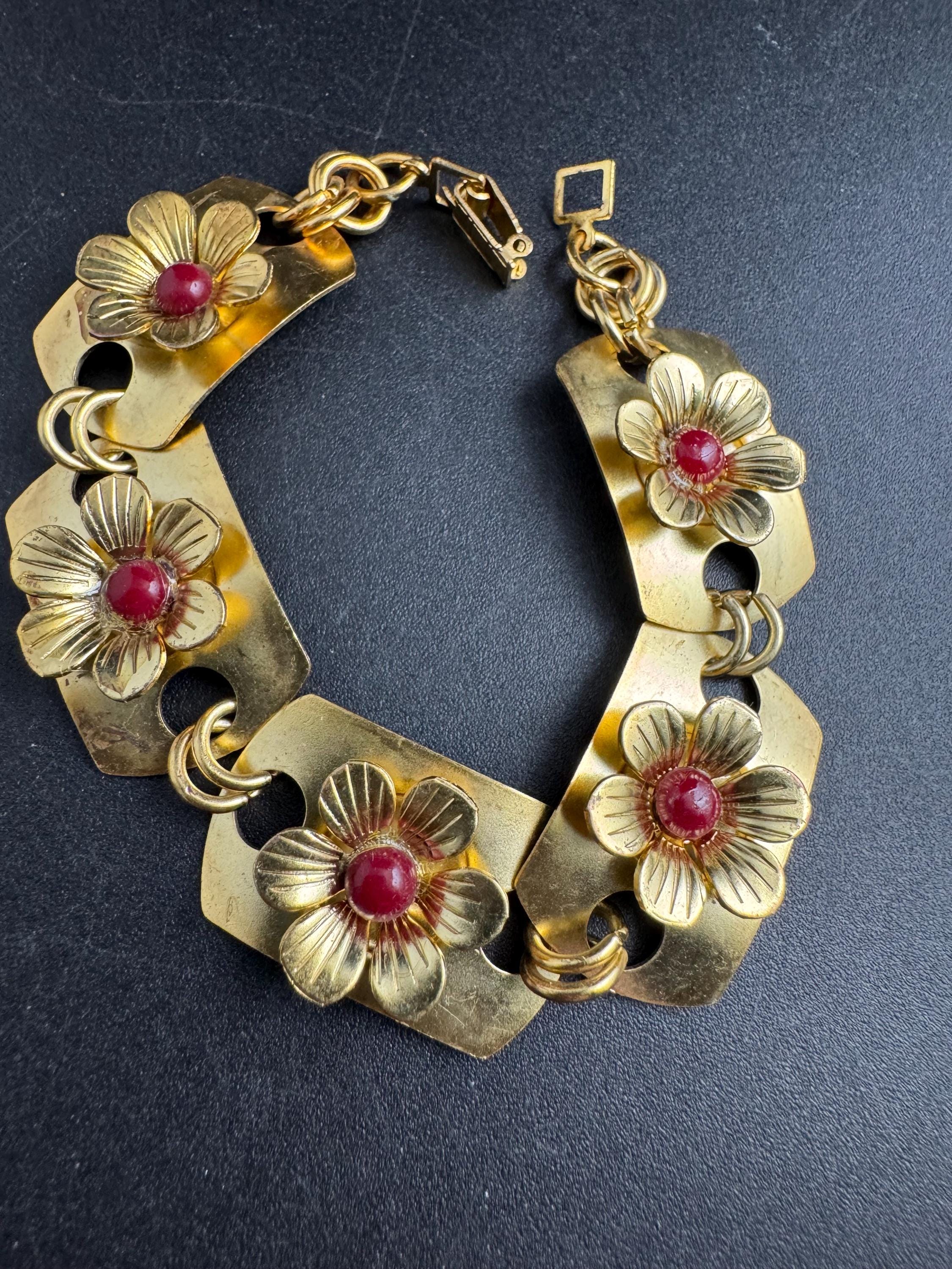 Art deco brass panel link flower bracelet , red cabochons vintage unused mid century