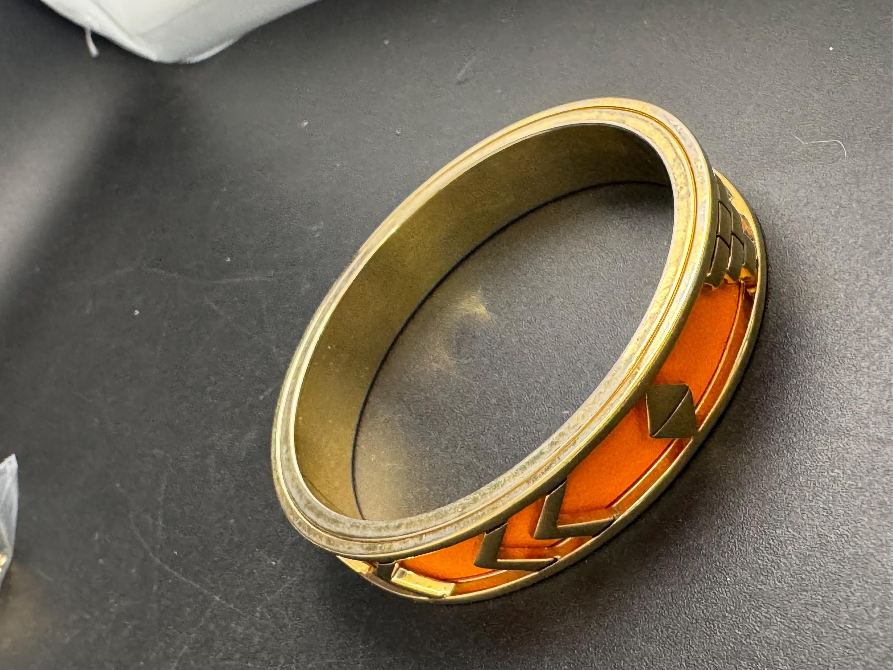 House of Harlow Orange inca bangle, enamelled 1960s gold plated