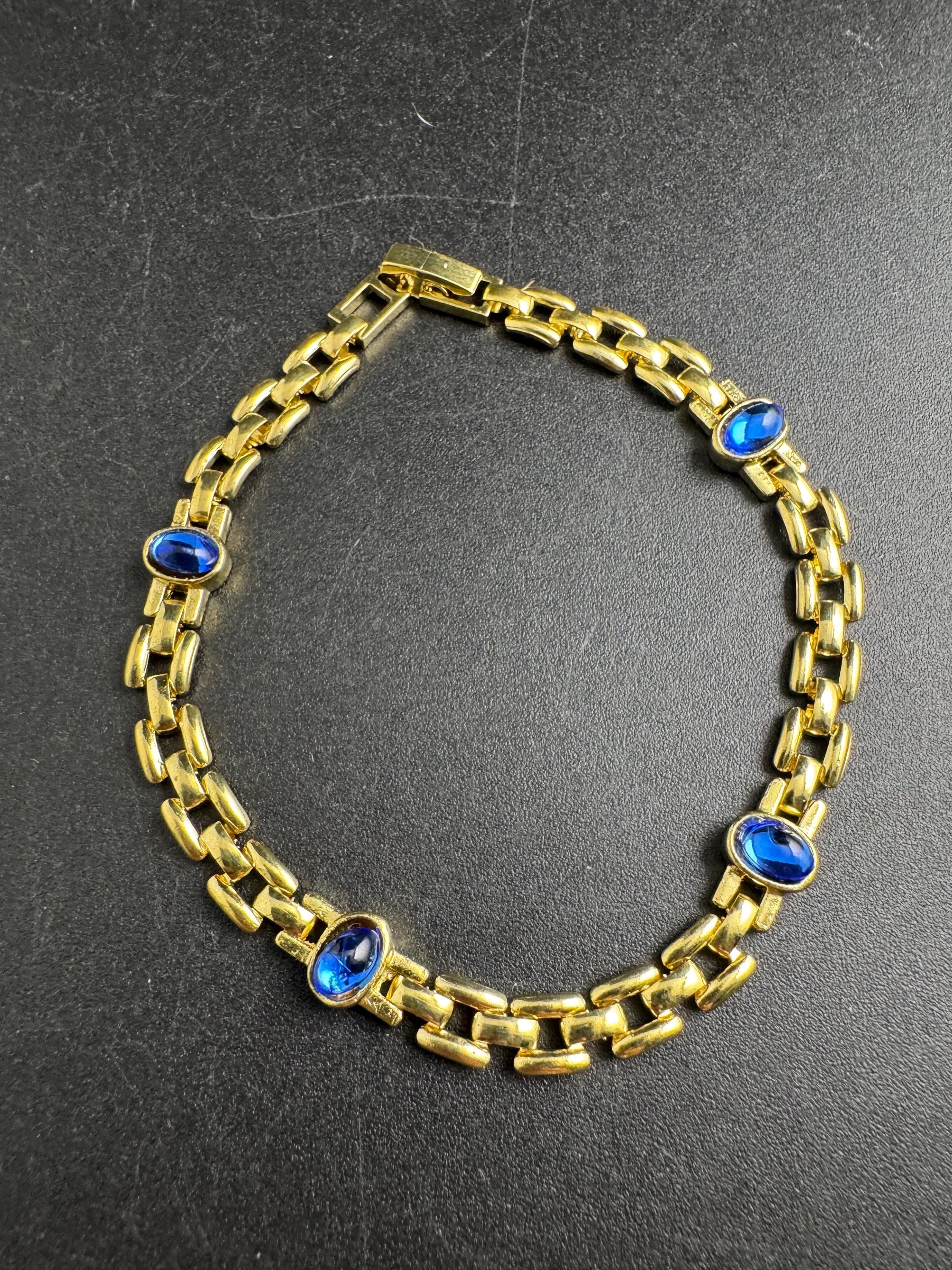 Slim Panther link rhinestone bracelet, sapphire blue oval cabochon crystals gold plated