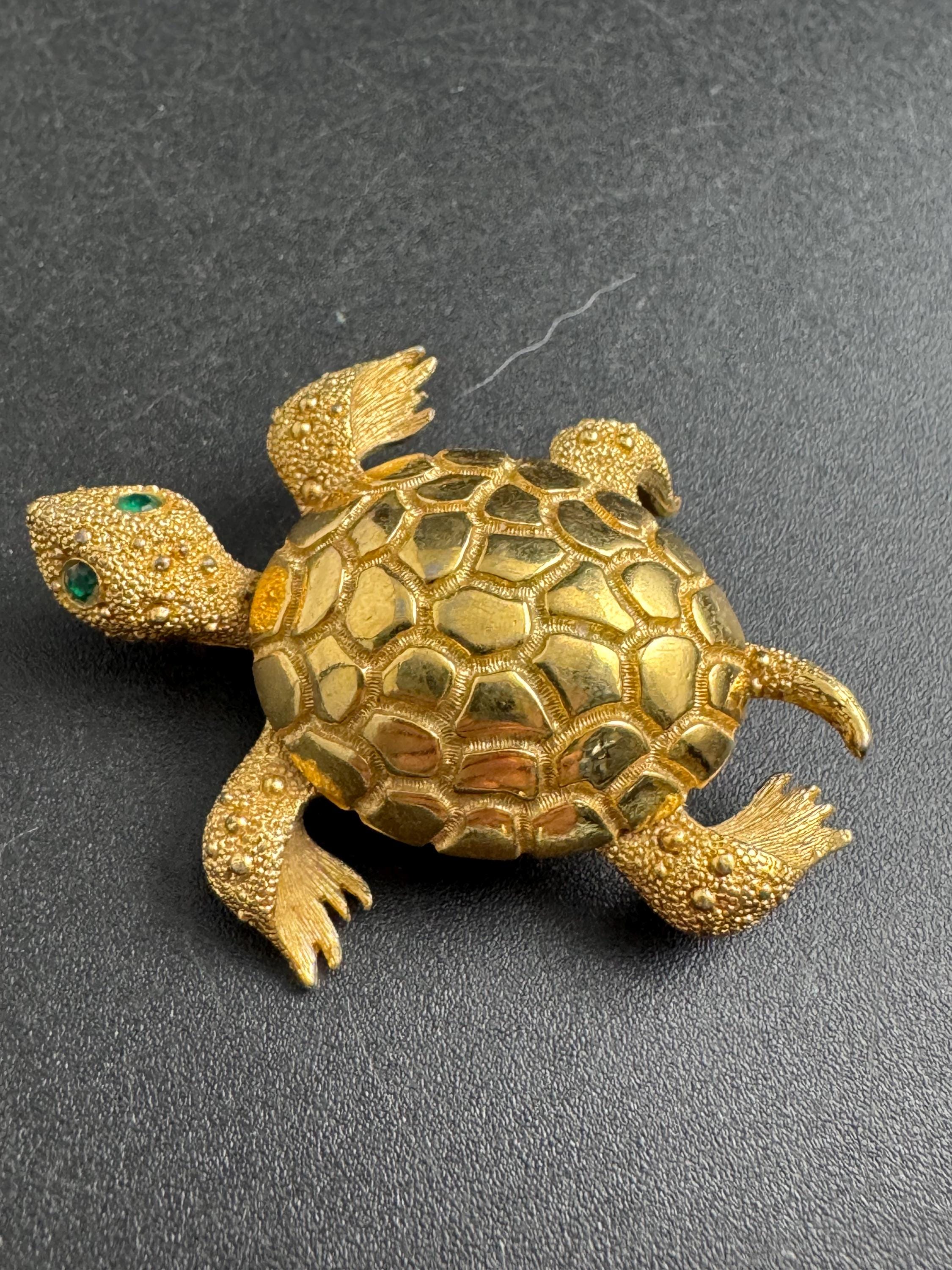 Monet gold turtle brooch, vintage gold tone pin emerald eyes