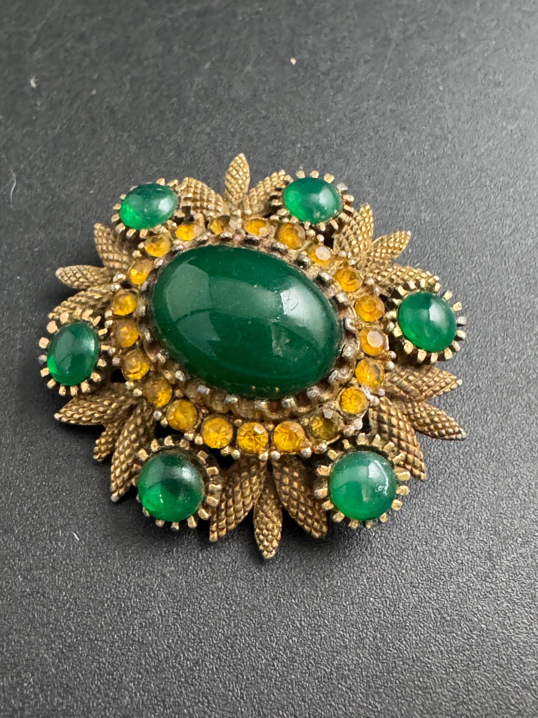 Sphinx emerald green cabochon brooch, vintage early piece gold tone and signed