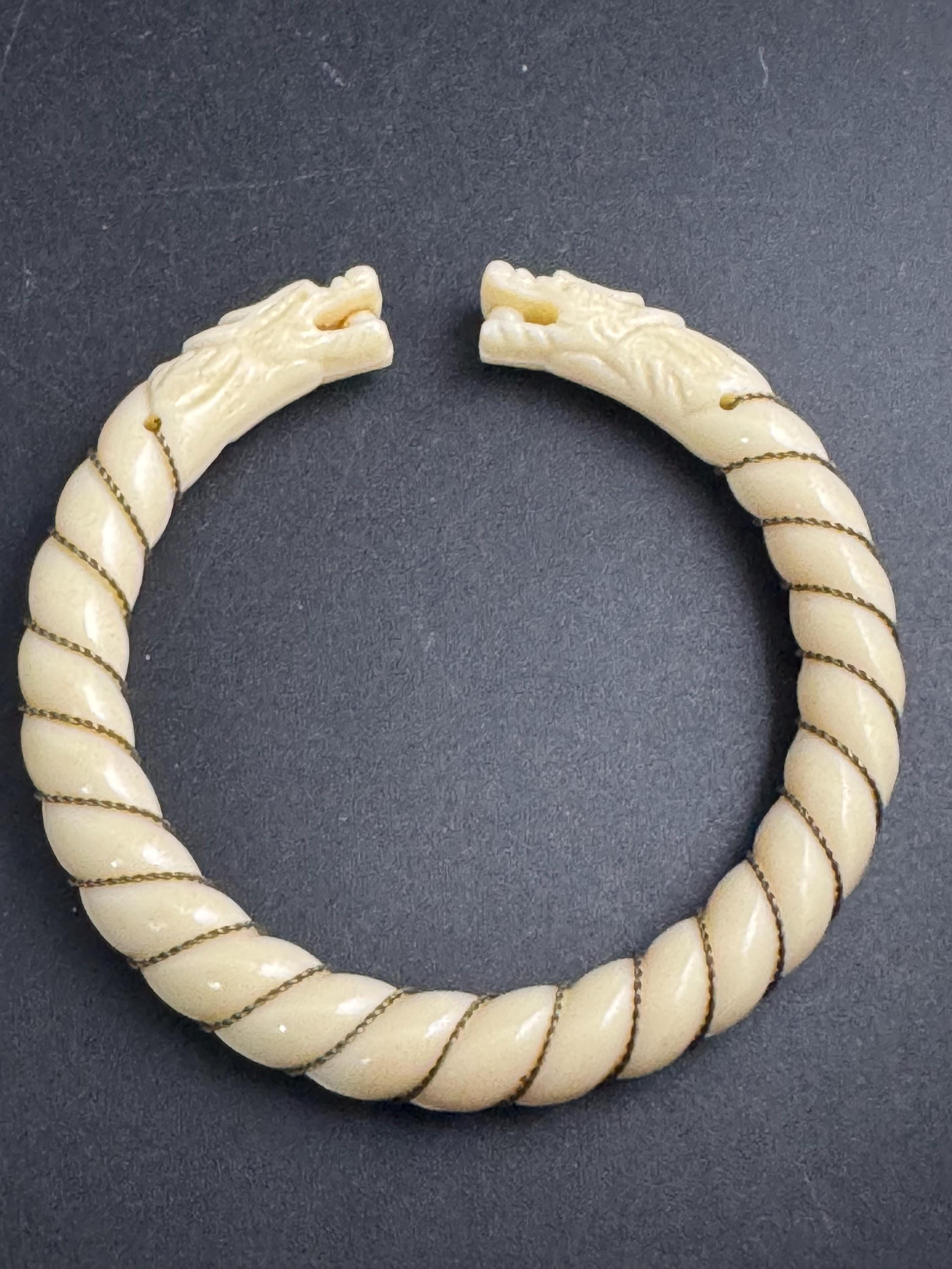 Early Plastic double dragon head bangle, wire wrapped celluloid twisted detail