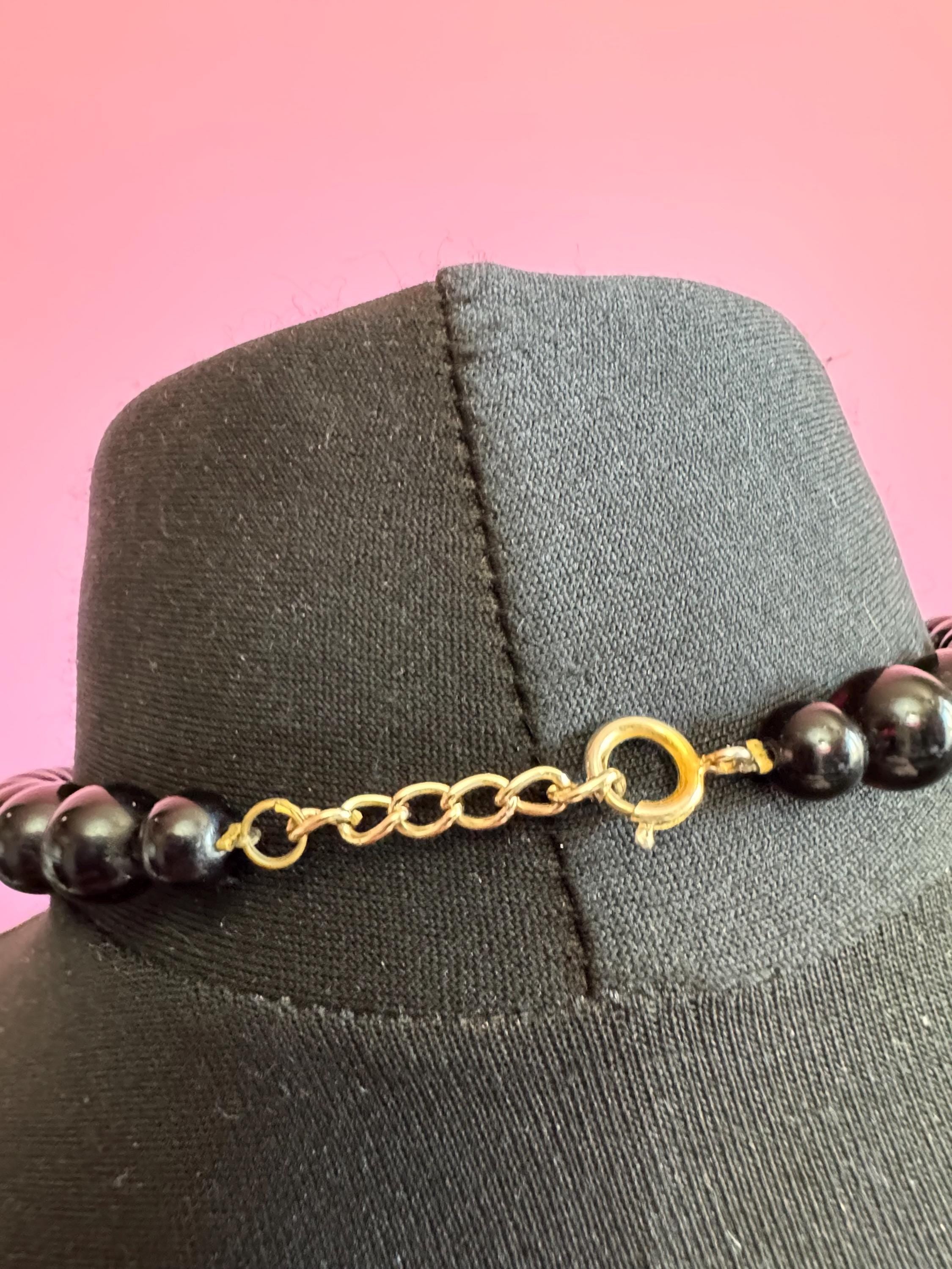 Black beaded statement necklace, red gold acrylic pendant