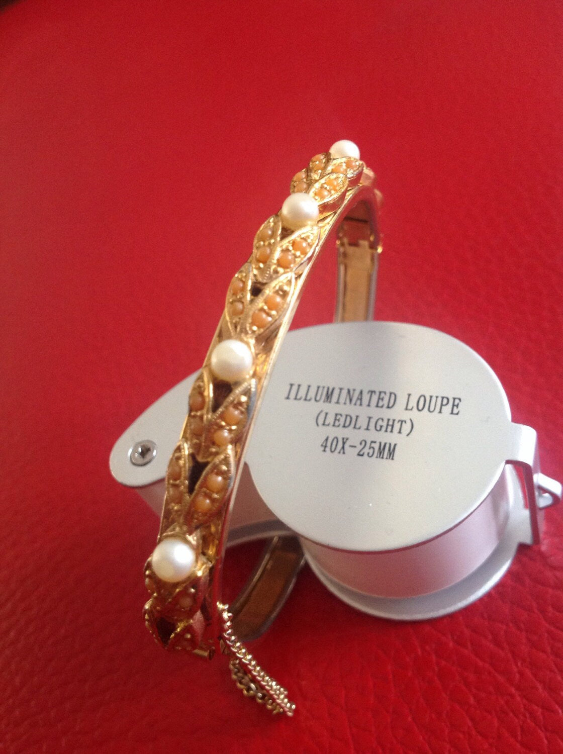 Vintage gold tone orange coral faux pearl ornate engraved bangle bracelet