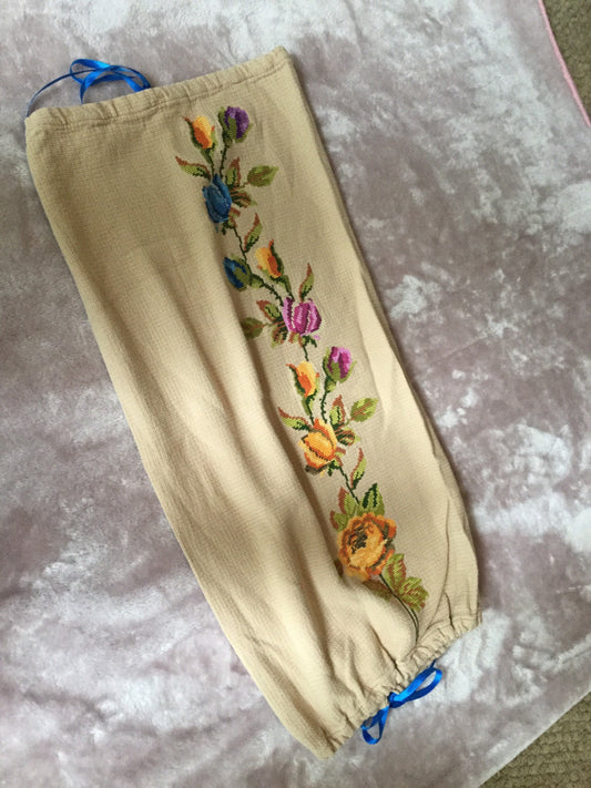 Antique vintage hand embroidered mid brown bolster tube cushion cover pillow case orange pink and blue embroidery flowers blue ribbon ties