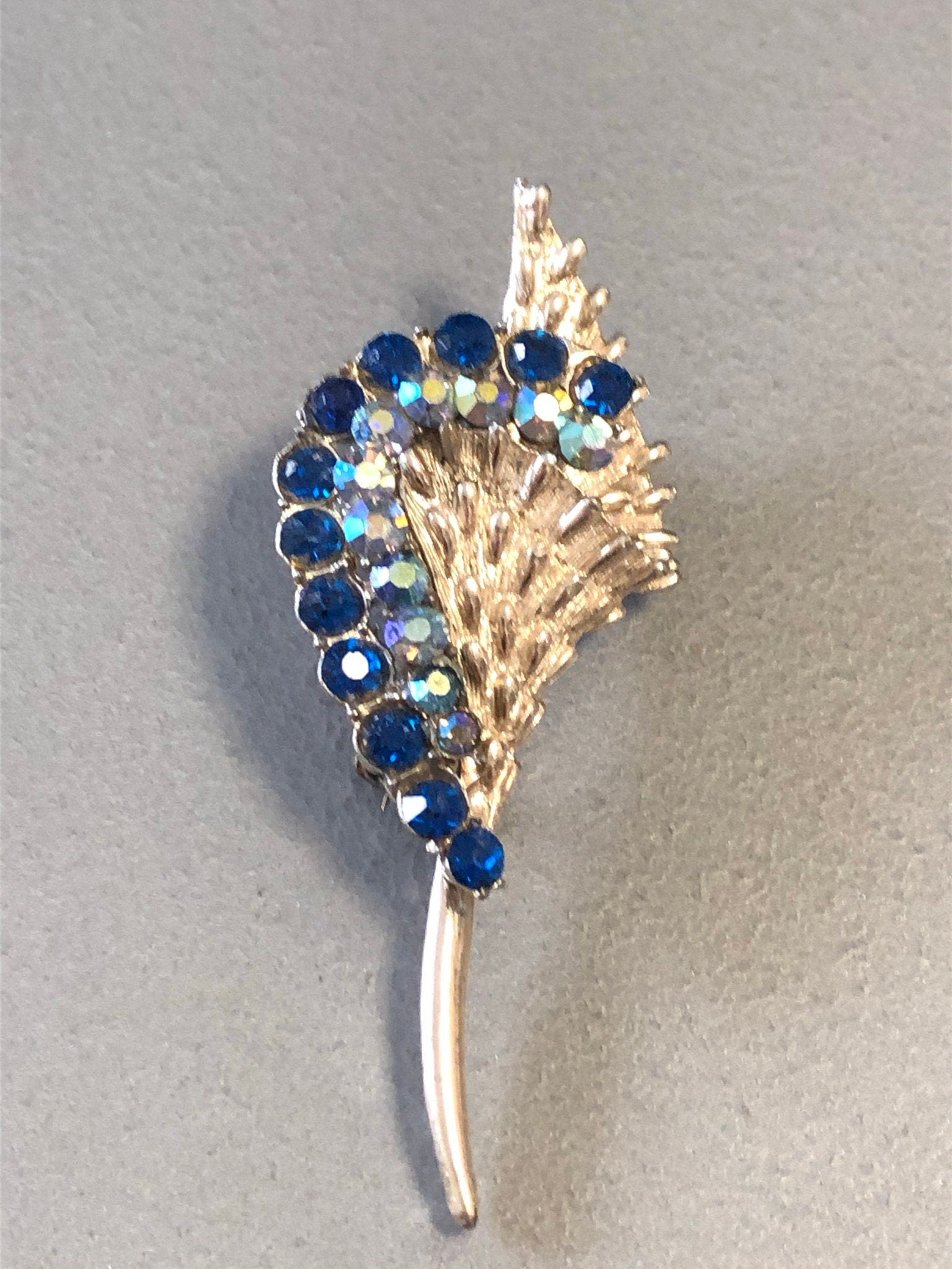 vintage silver tone sapphire blue rhinestone floral brooch mid century