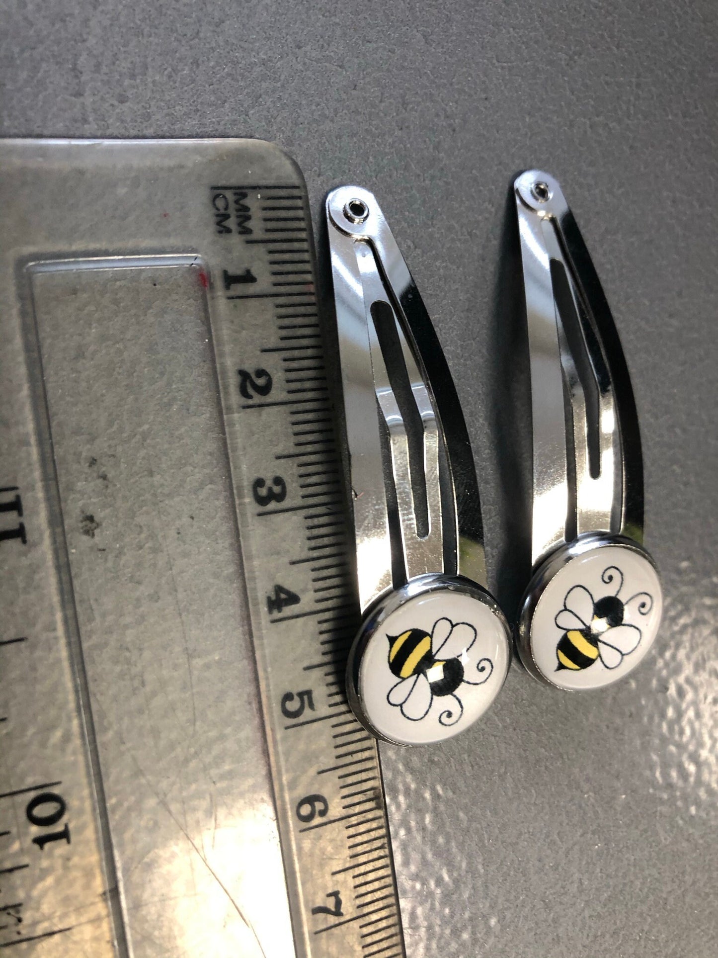 pair of bee hair clips silver tone snap lock closure