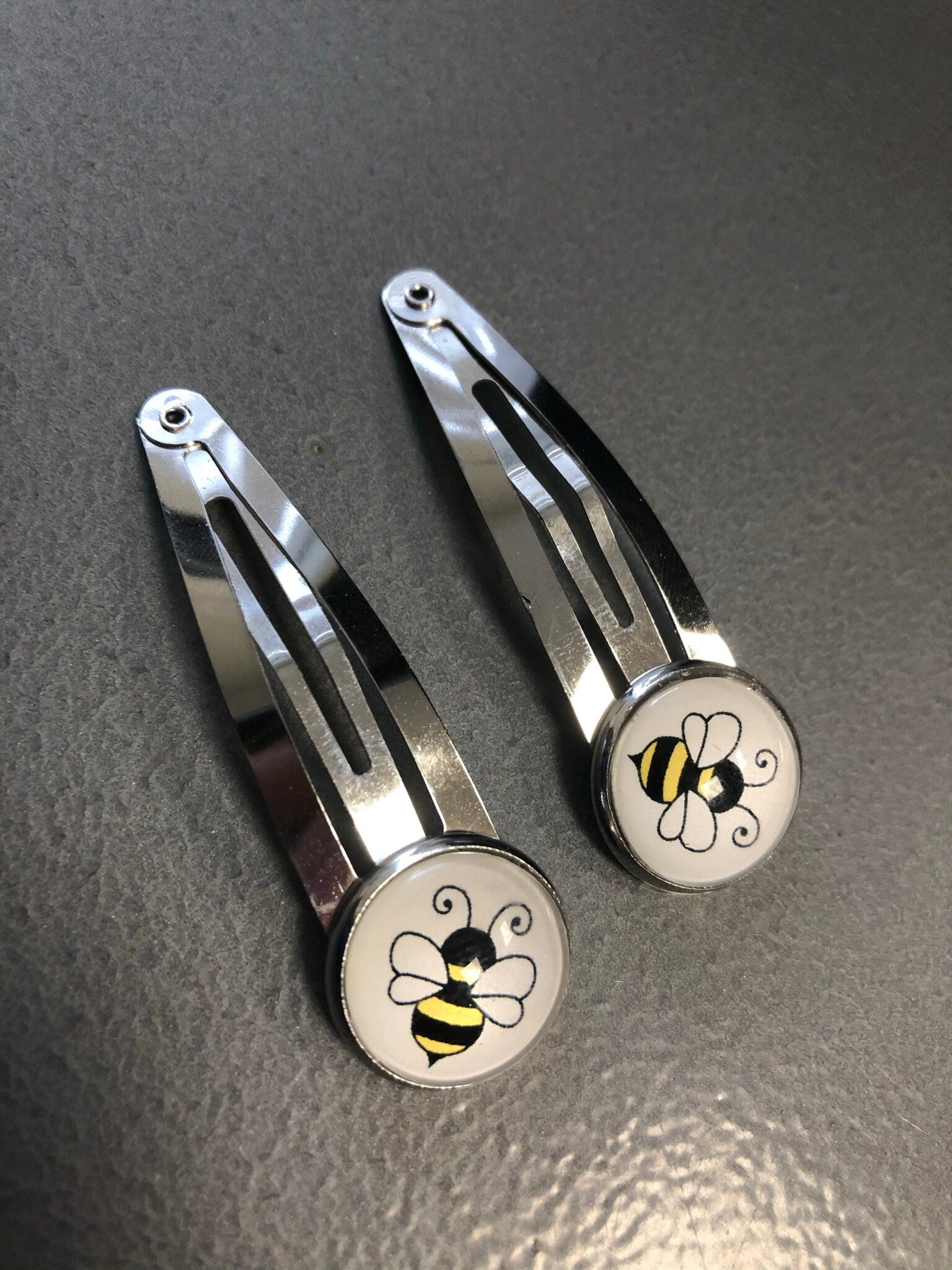 pair of bee hair clips silver tone snap lock closure
