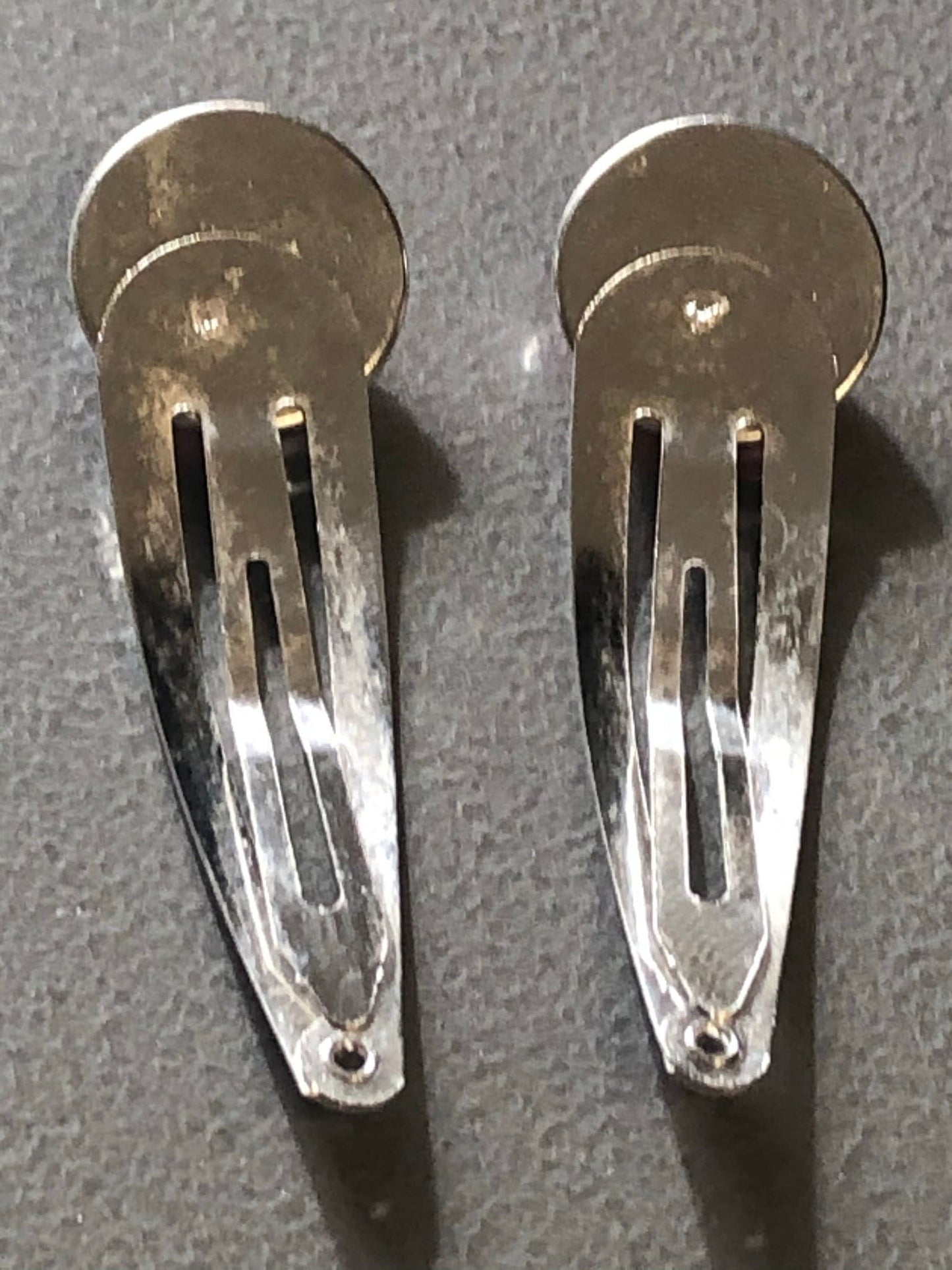 pair of Unicorn hair clips silver tone snap lock closure