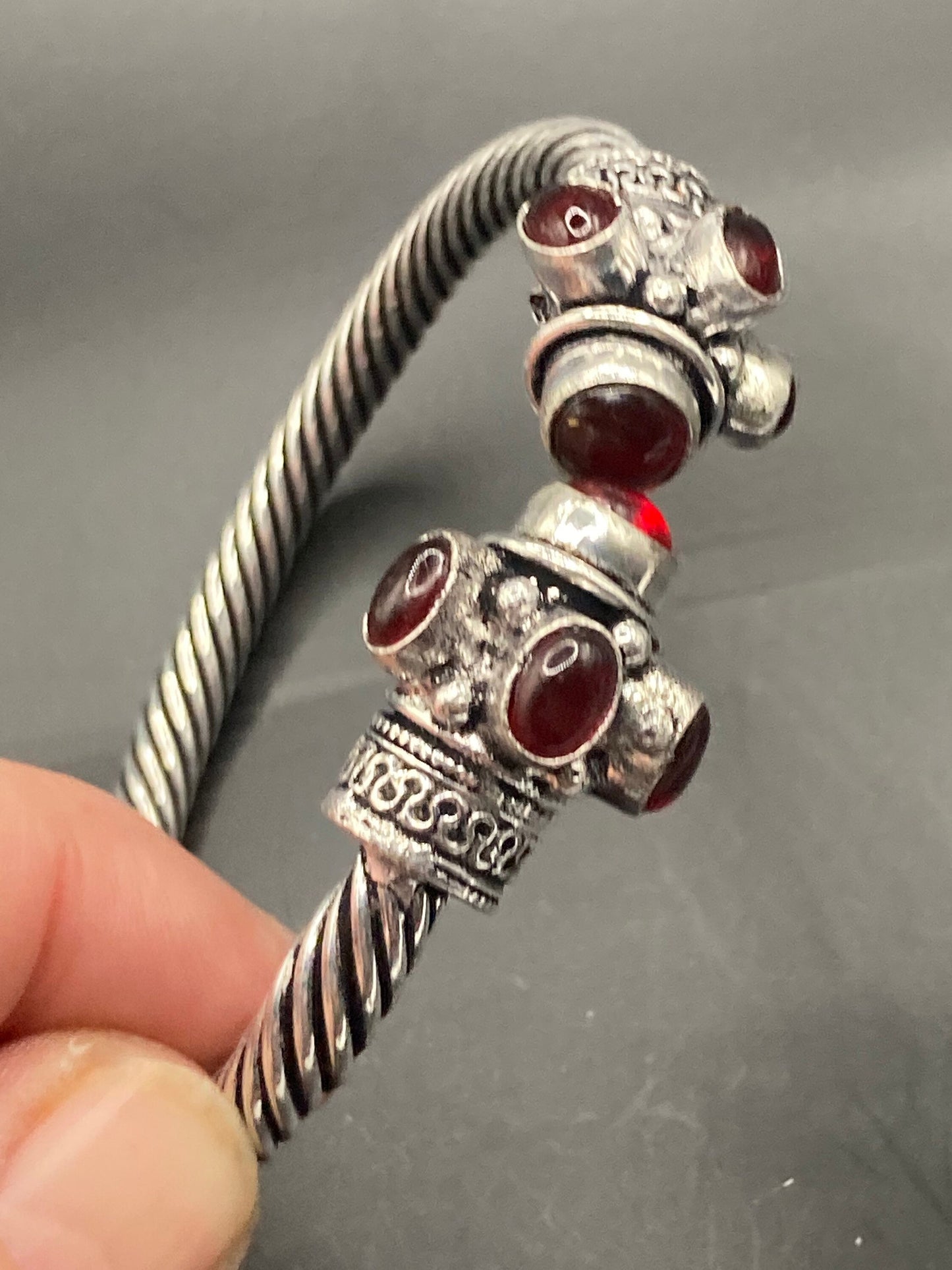 silver tone metal torque cuff bangle bracelet ruby red garnet glass stones