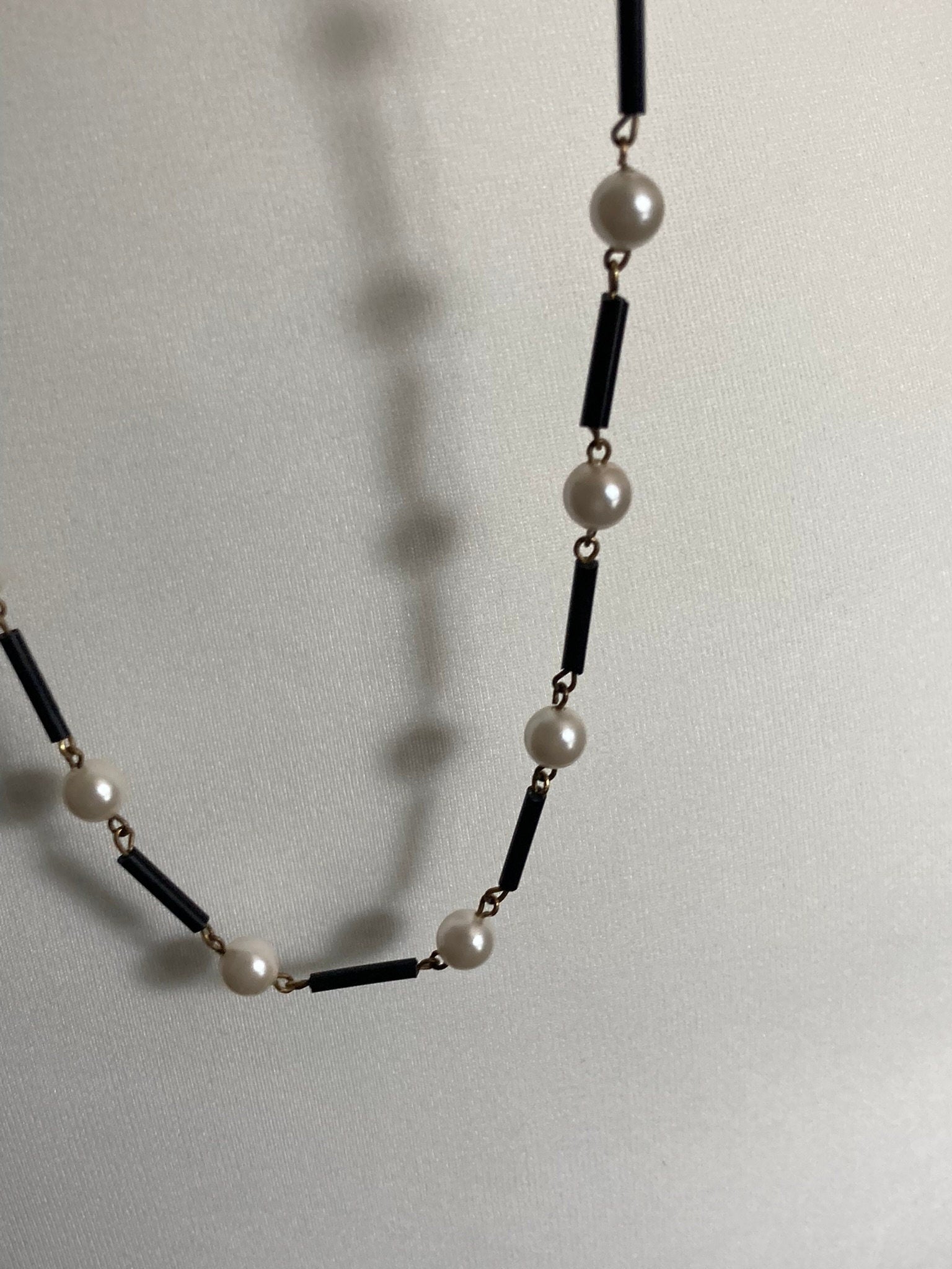 Flapper length MCM cream plastic pearl necklace with black glass bugle beads