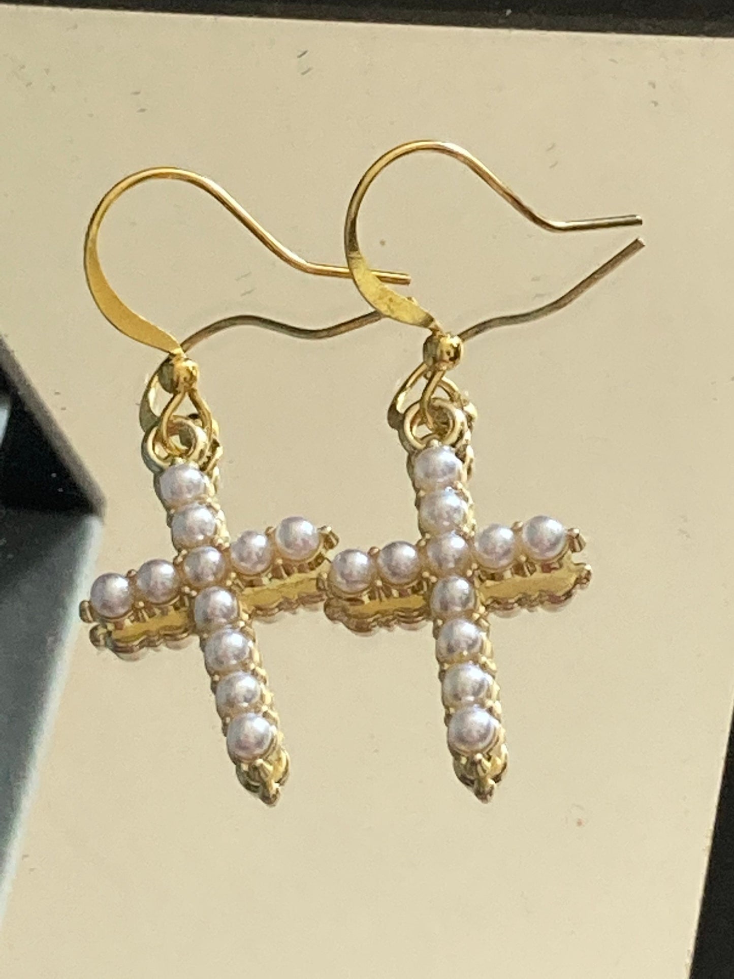Handmade gold tone white seed Pearl cross drop earrings
