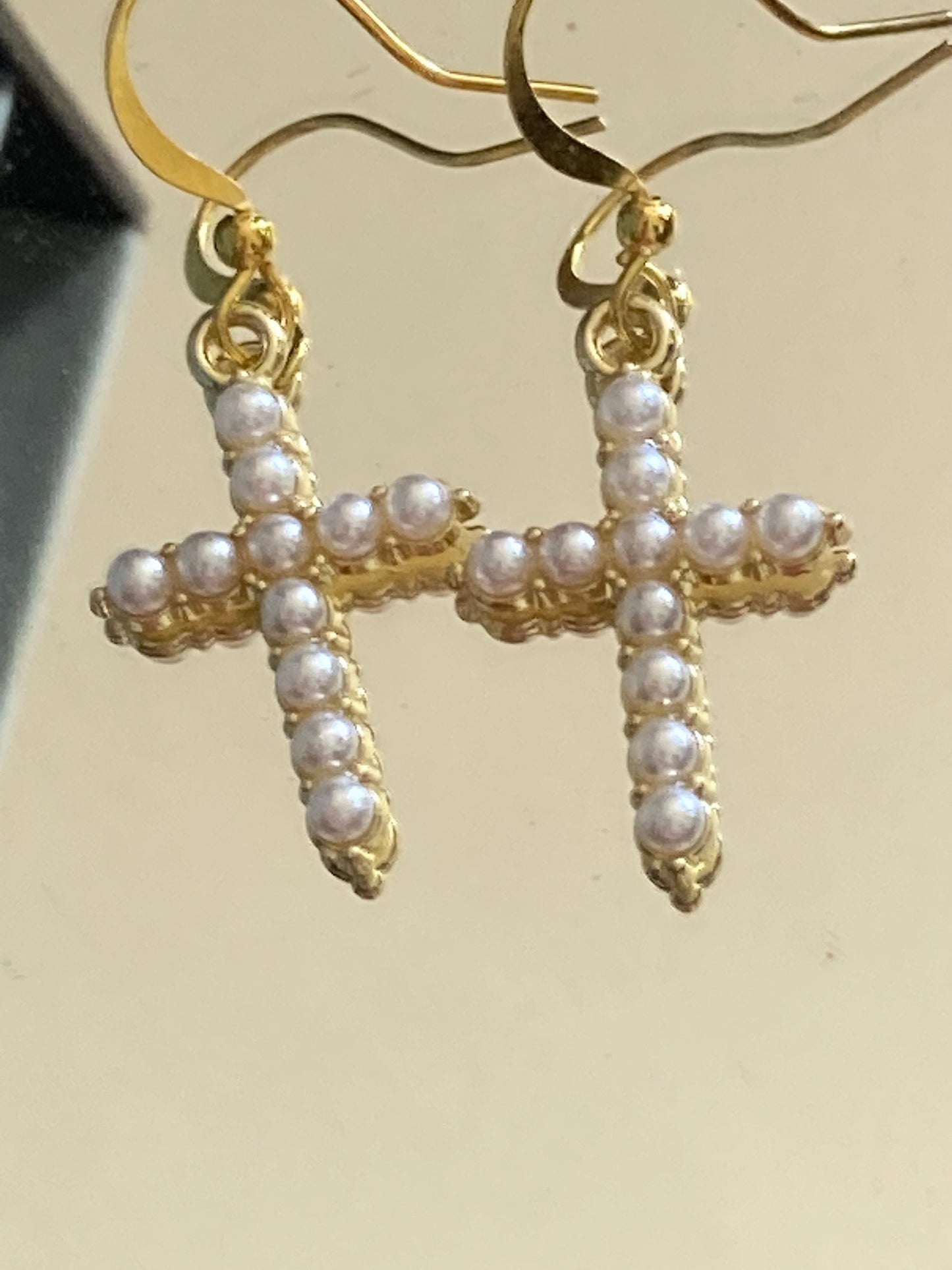 Handmade gold tone white seed Pearl cross drop earrings