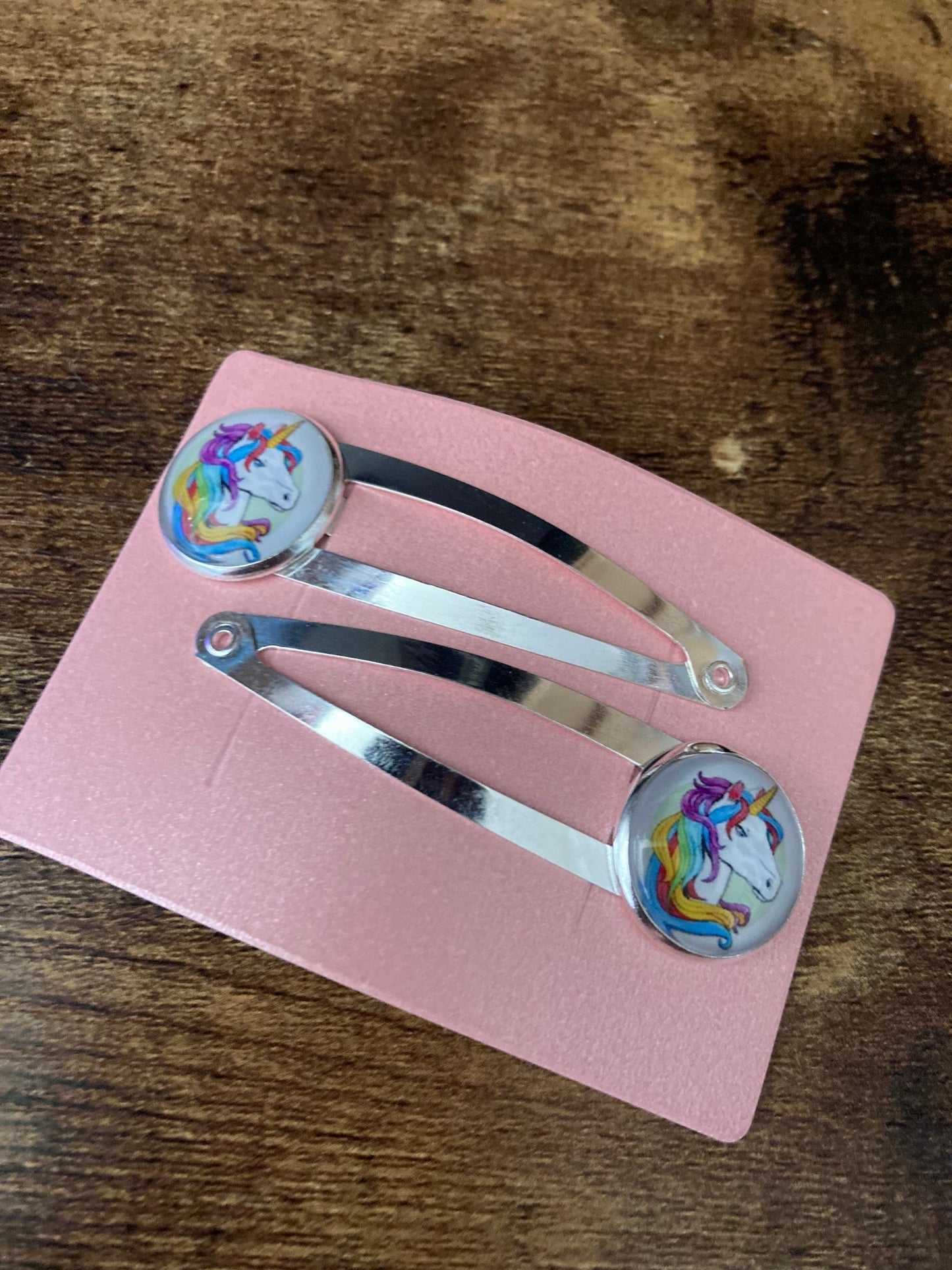 pair of Unicorn hair clips silver tone snap lock closure