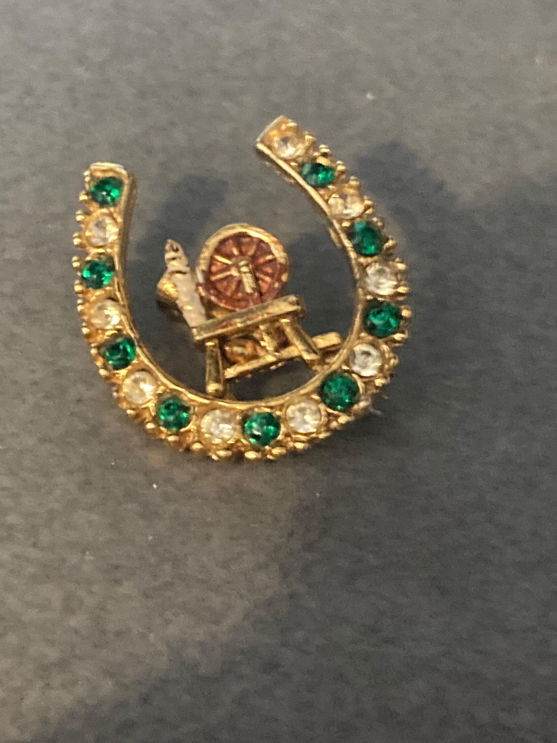 Spinning wheel Vintage lucky horseshoe clear green diamanté gold brooch