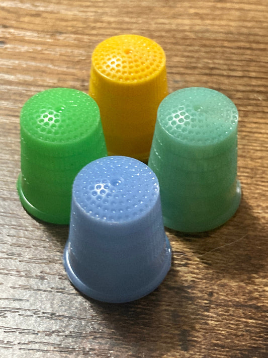 Size S small set of 4 Art Deco galalith early plastic coloured sewing thimbles