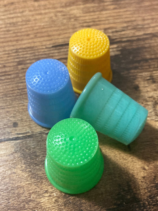 Size M Medium set of 4 Art Deco galalith early plastic coloured sewing thimbles
