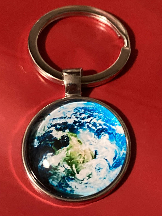 Aerial view of earth globe world silver tone keyring glass cabochon